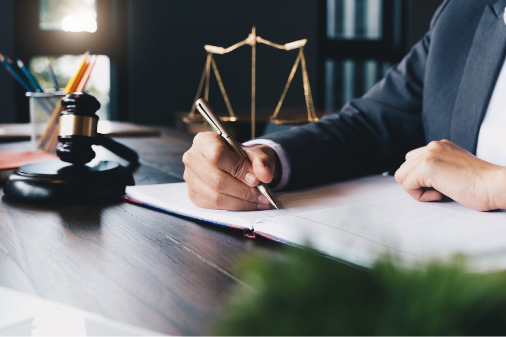 Close-up of person signing business licenses